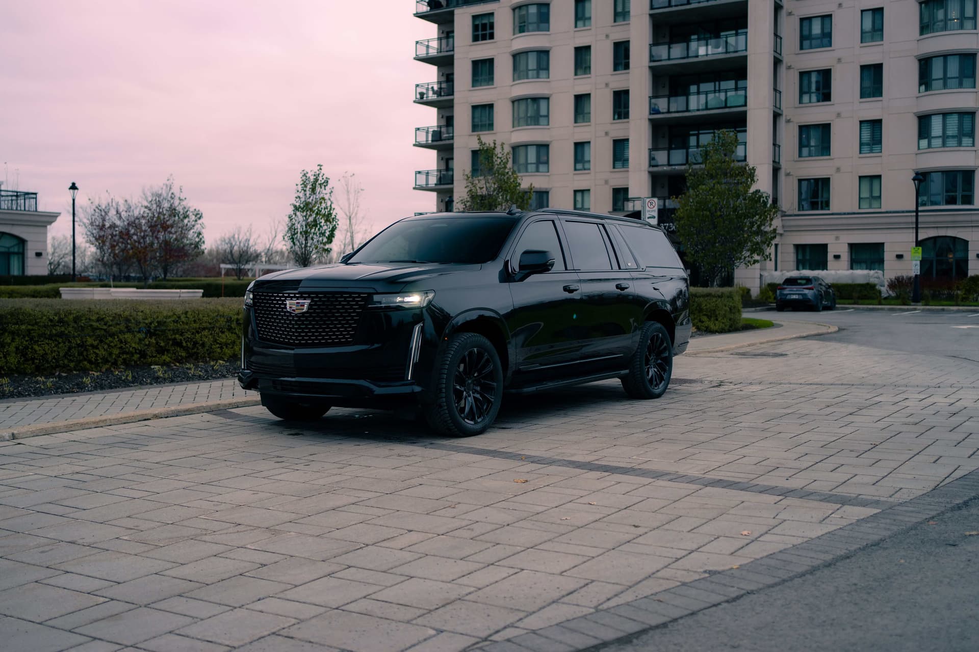 Black Cadillac Escalade ESV with vertical LED lights in a dark studio — photo 5