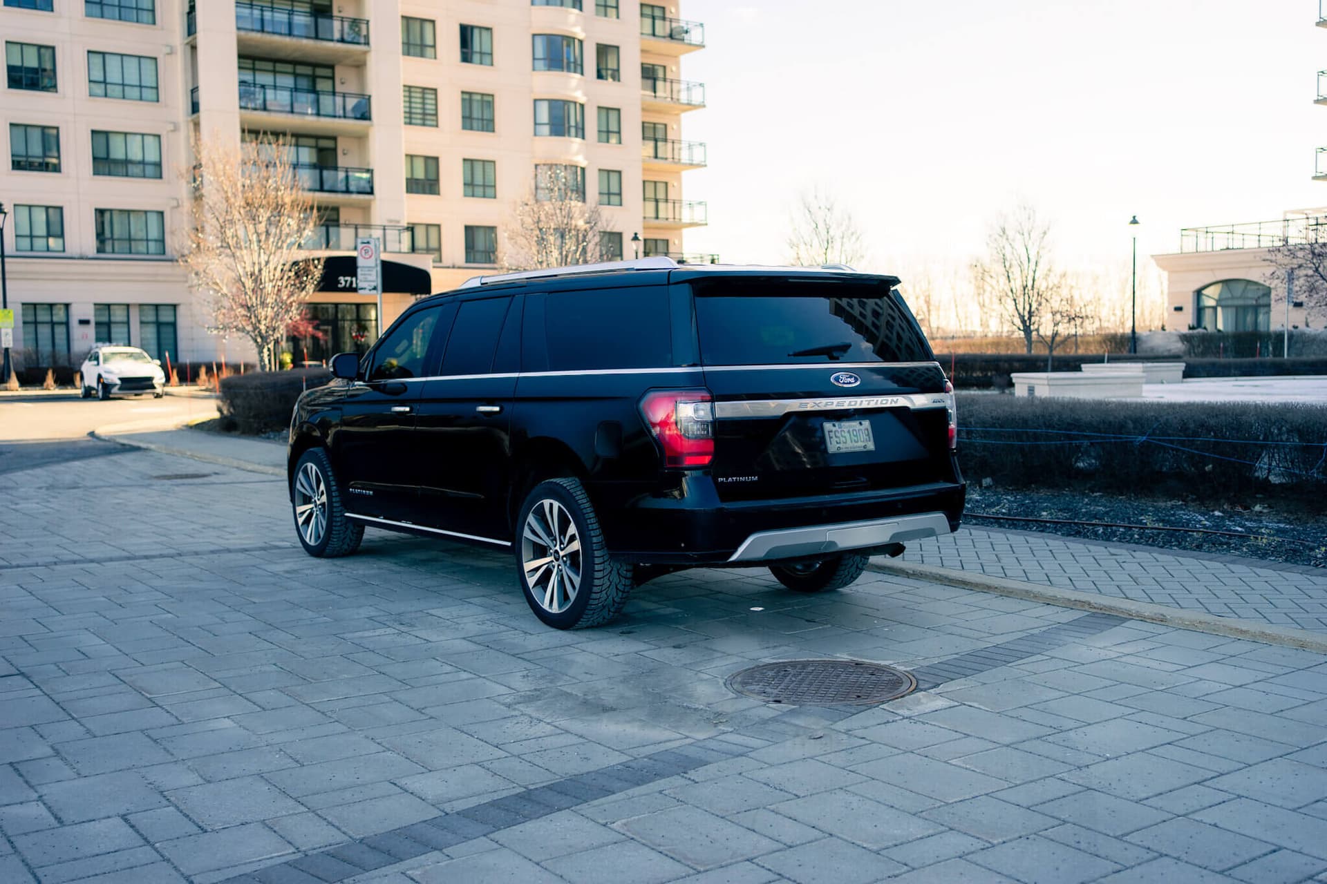Black Ford Expedition Max in a dark studio with warm rim light — photo 3