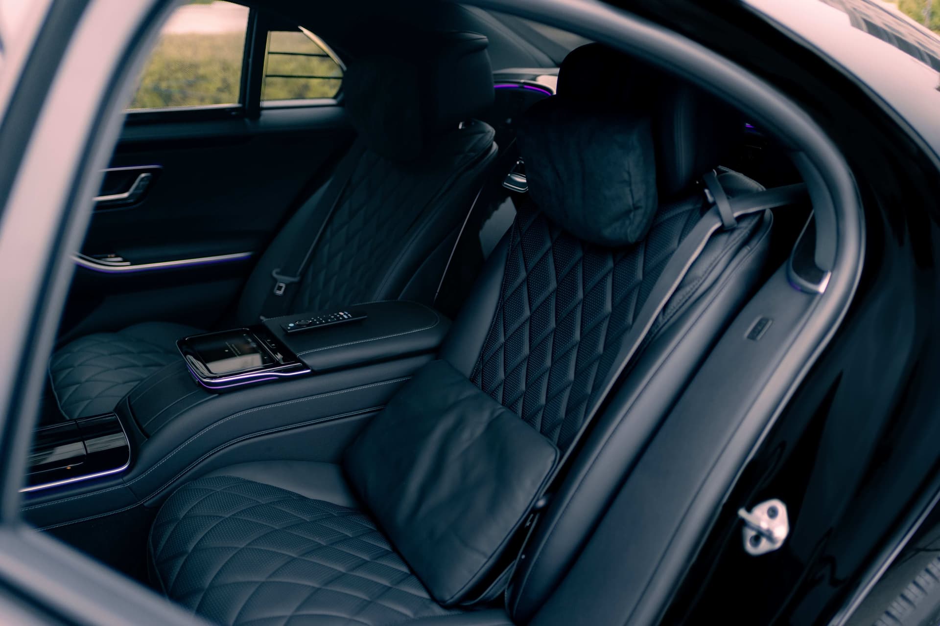 Black Mercedes-Benz S580 in dramatic golden studio light — photo 6