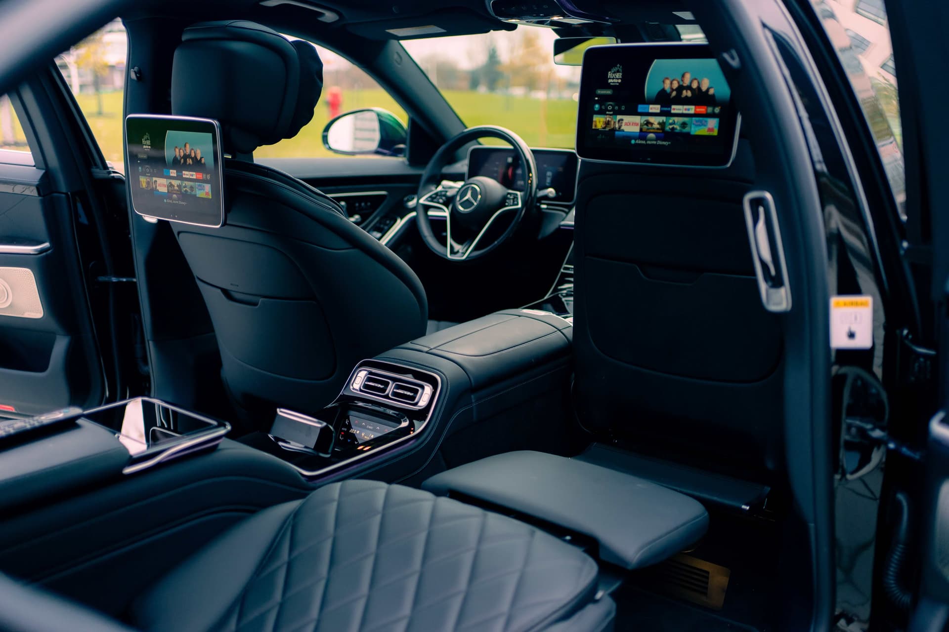 Black Mercedes-Benz S580 in dramatic golden studio light — photo 7